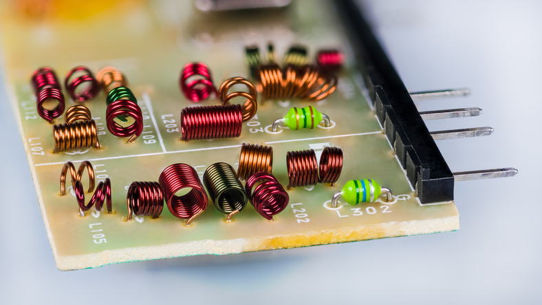 Red radio frequency inductors and green chokes inside RF module of television receiver